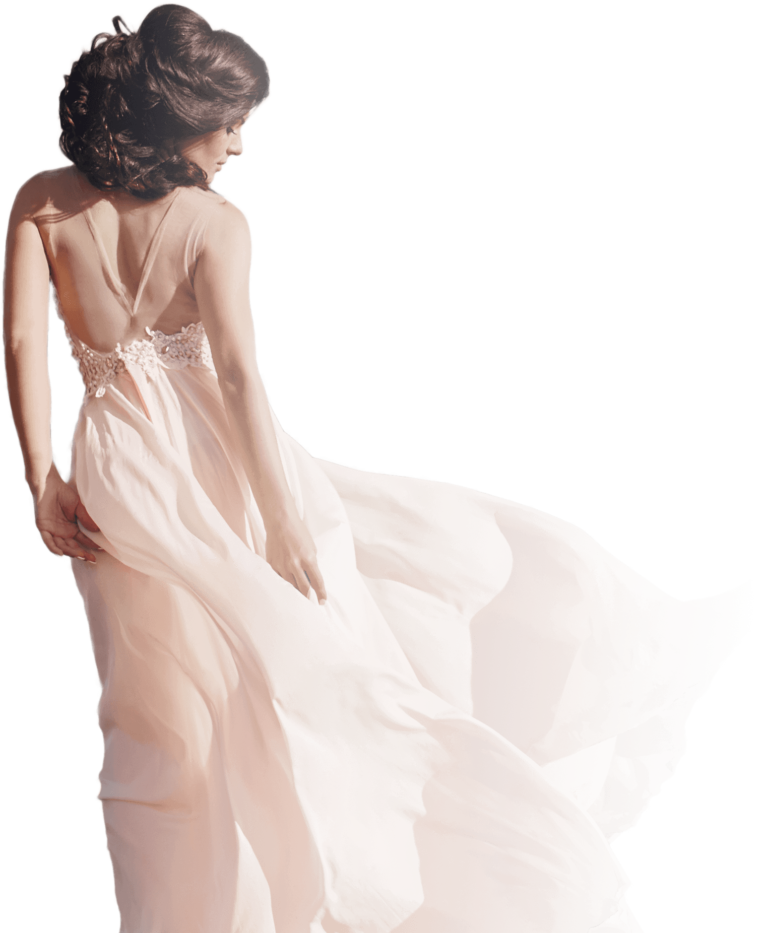 Junge Frau in einem maßgeschneiderten wehenden weißen Kleid